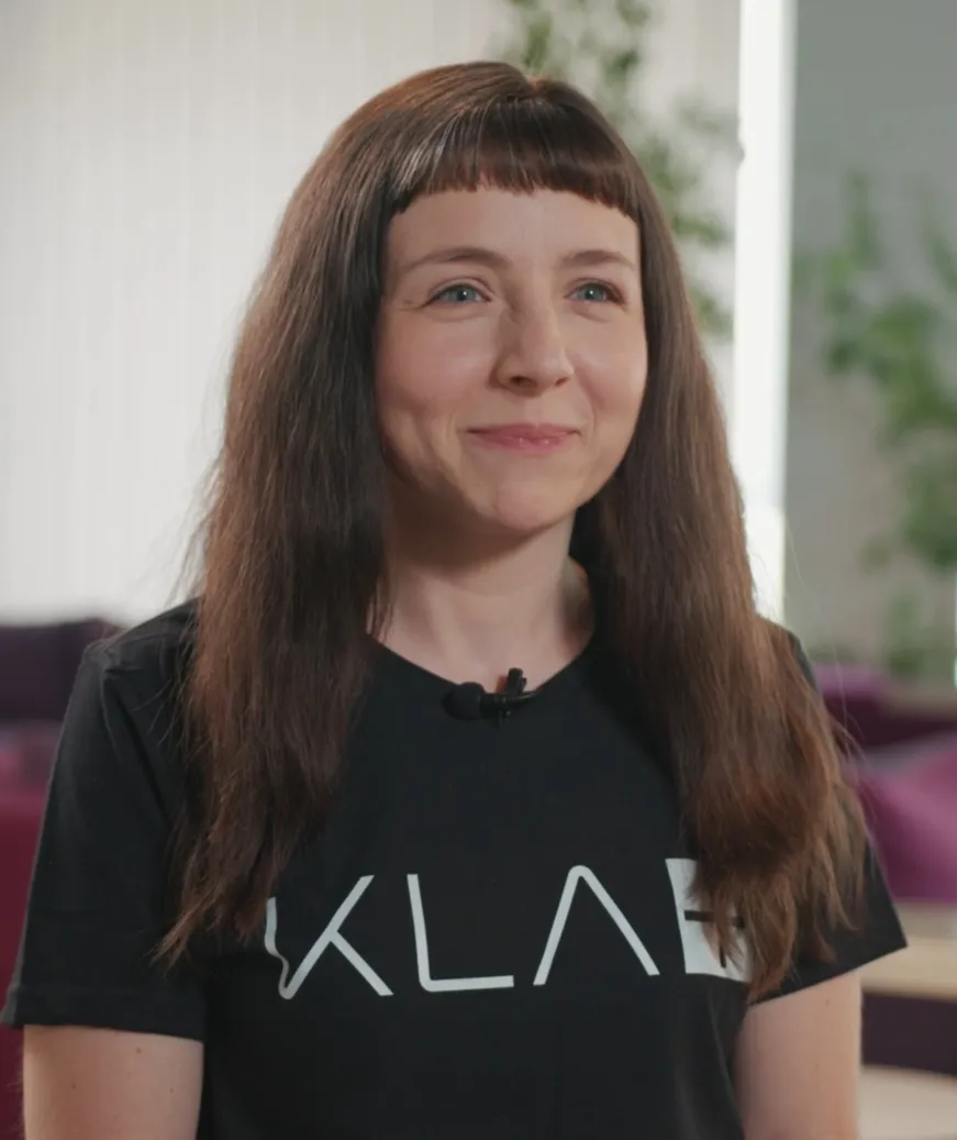 Smiling employee during employer branding video shoot, authentic and friendly recruiting image.